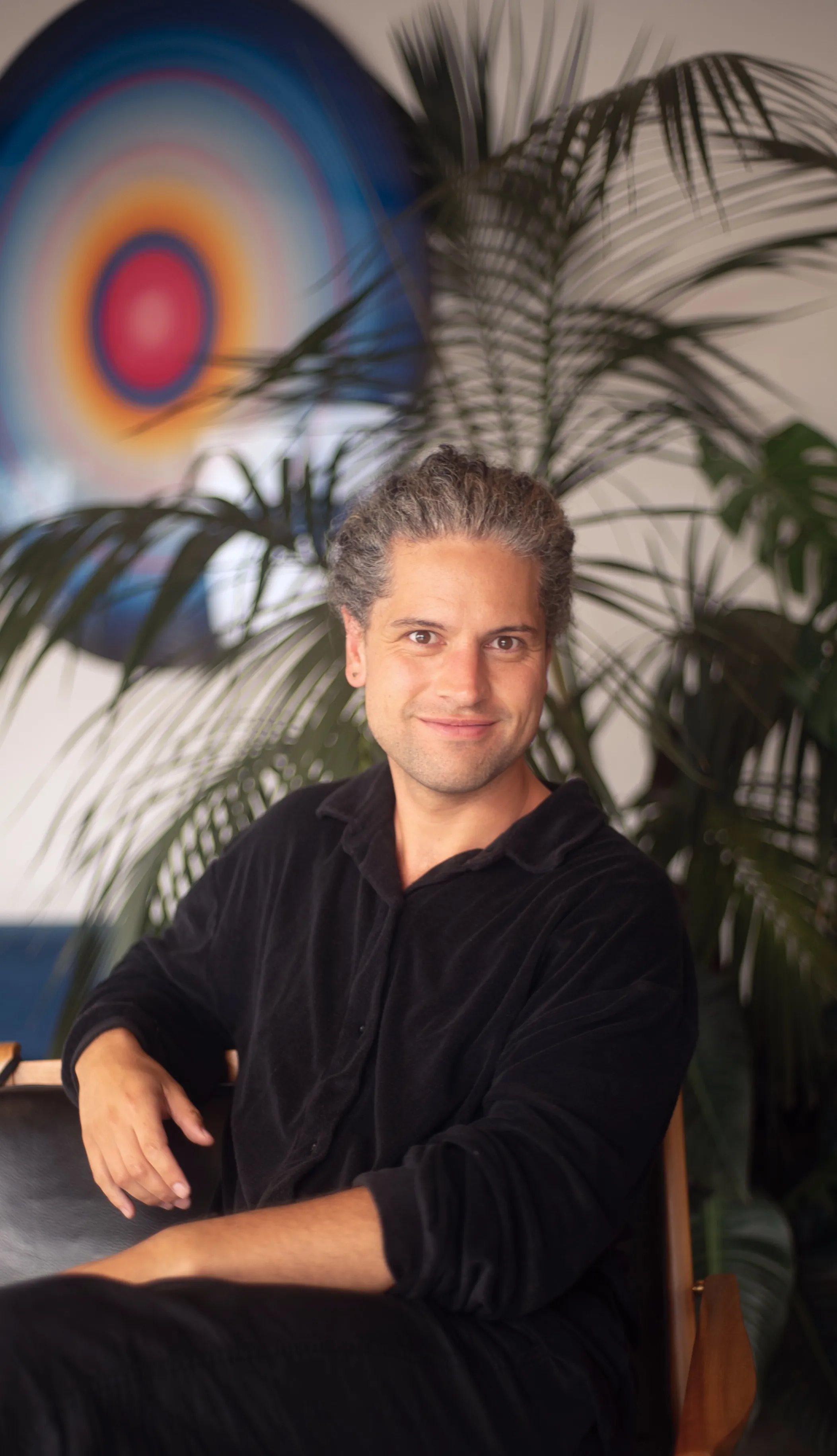 Tamanu's founder seated in the studio